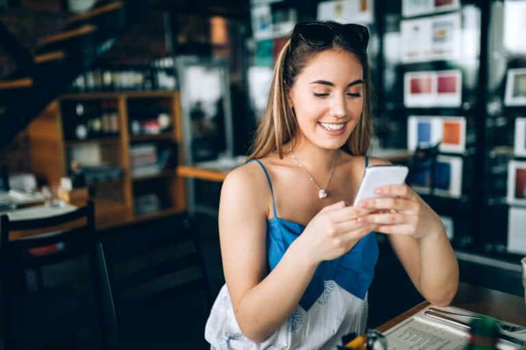 Woman smiling on her phone