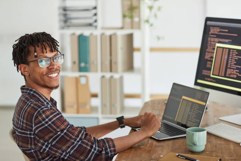 IT specialist smiling at work