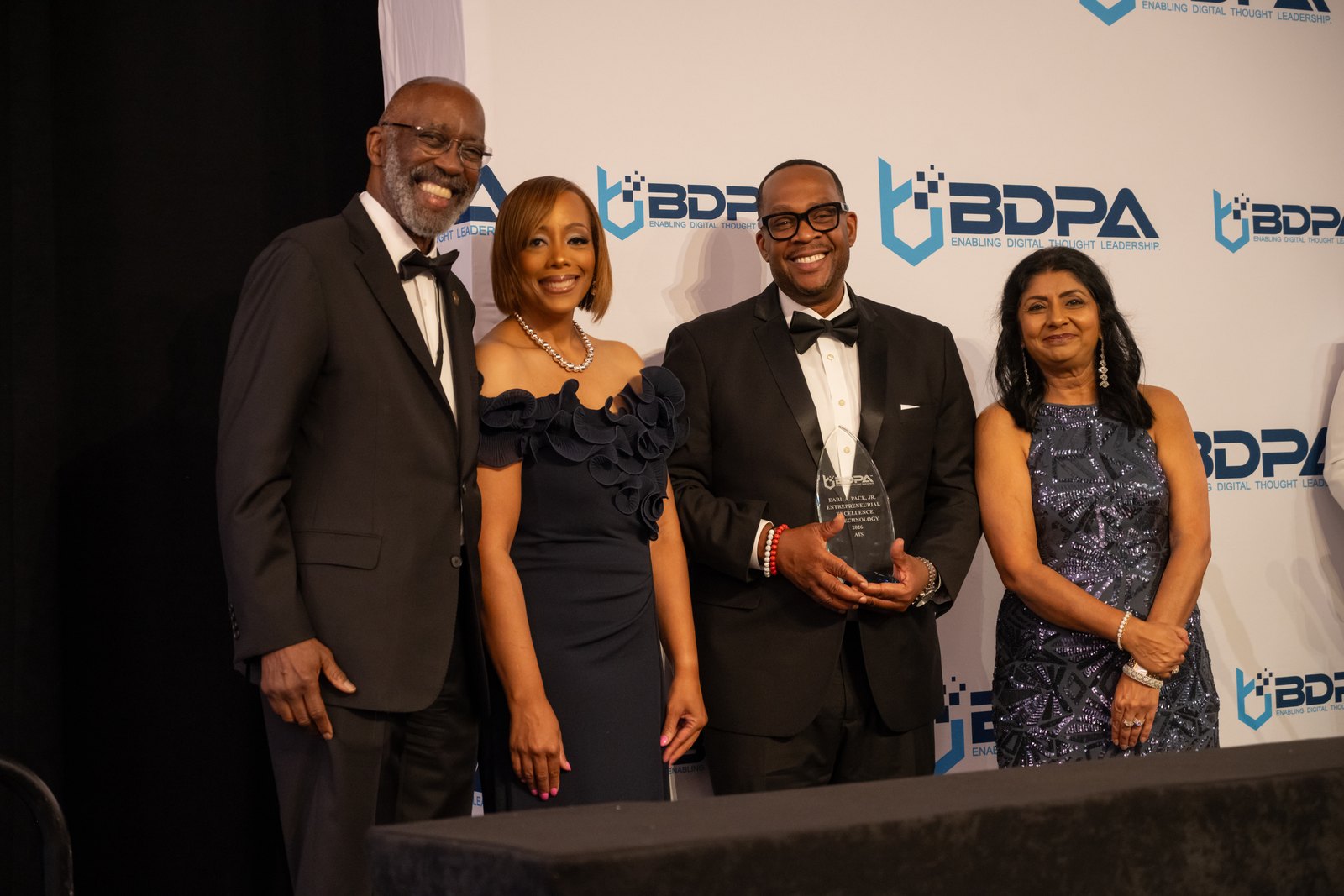 AIS Chief Executive Officer Lamont Hatcher accepting the 2026 Earl A. Pace, Jr. Award for Entrepreneurial Excellence in Technology